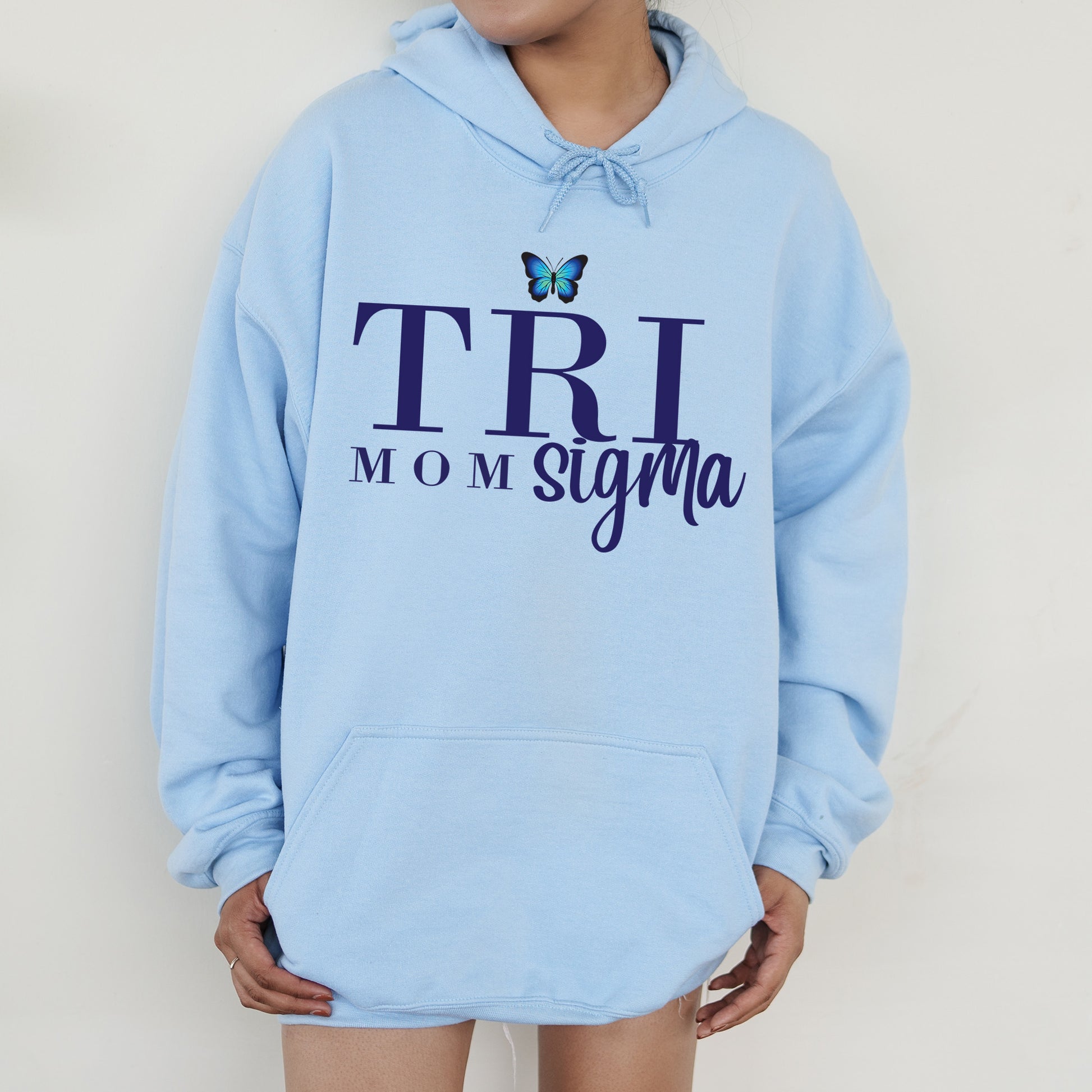 a woman wearing a blue hoodie with a butterfly on it