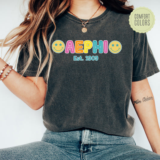 a woman wearing a black shirt with the word aepho on it