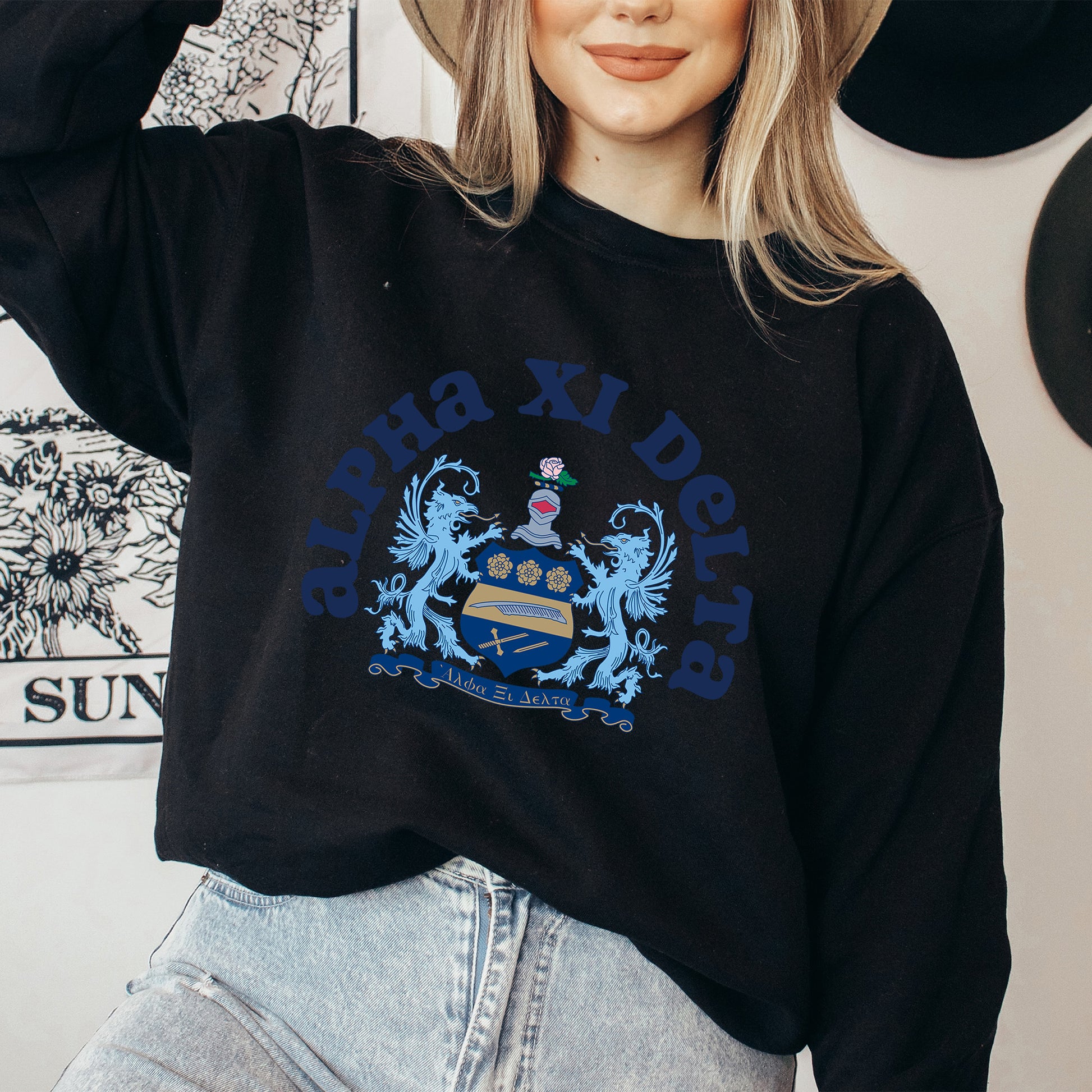 a woman wearing a hat and a black sweatshirt