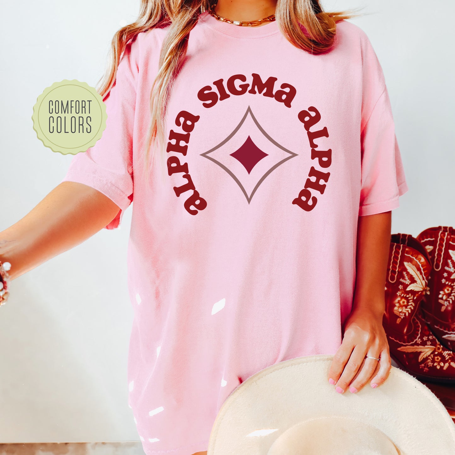 a woman wearing a pink shirt and hat