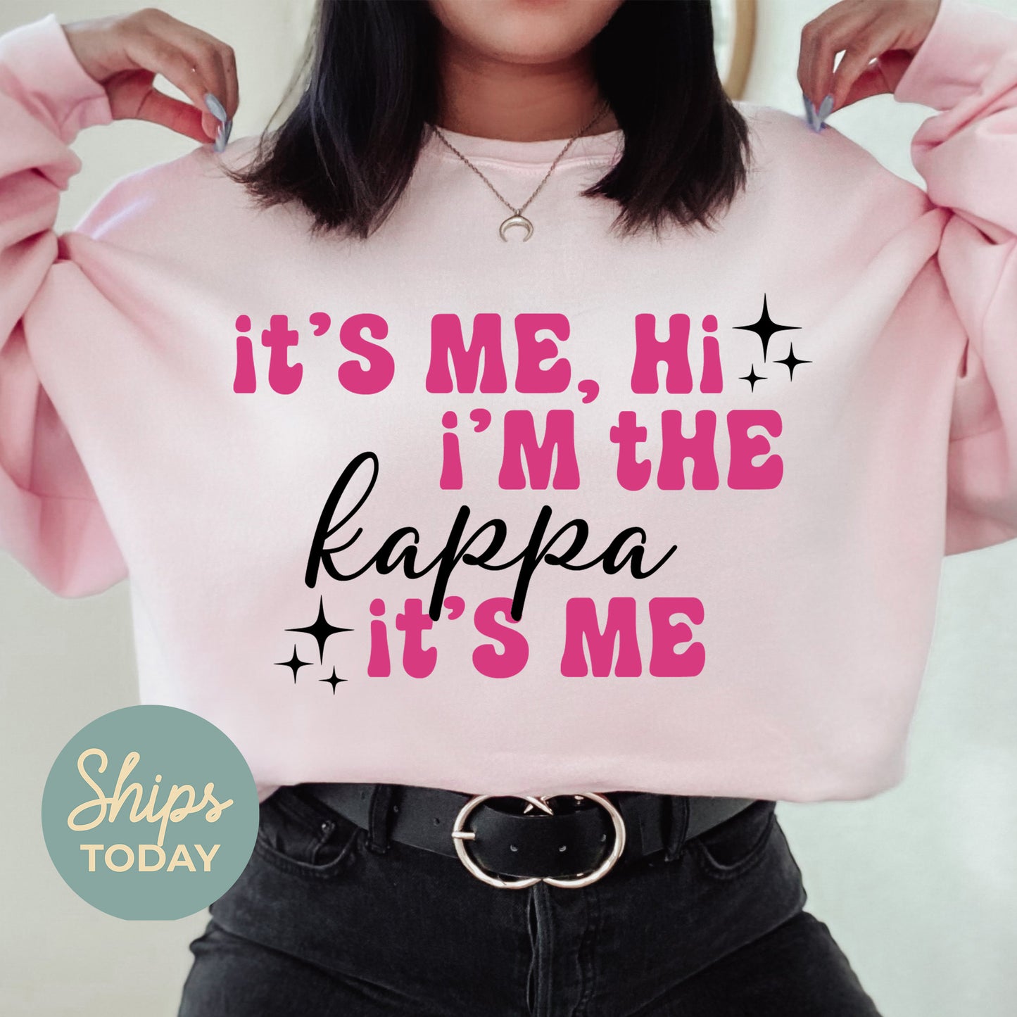 a woman wearing a pink sweatshirt that says it's me, i'm