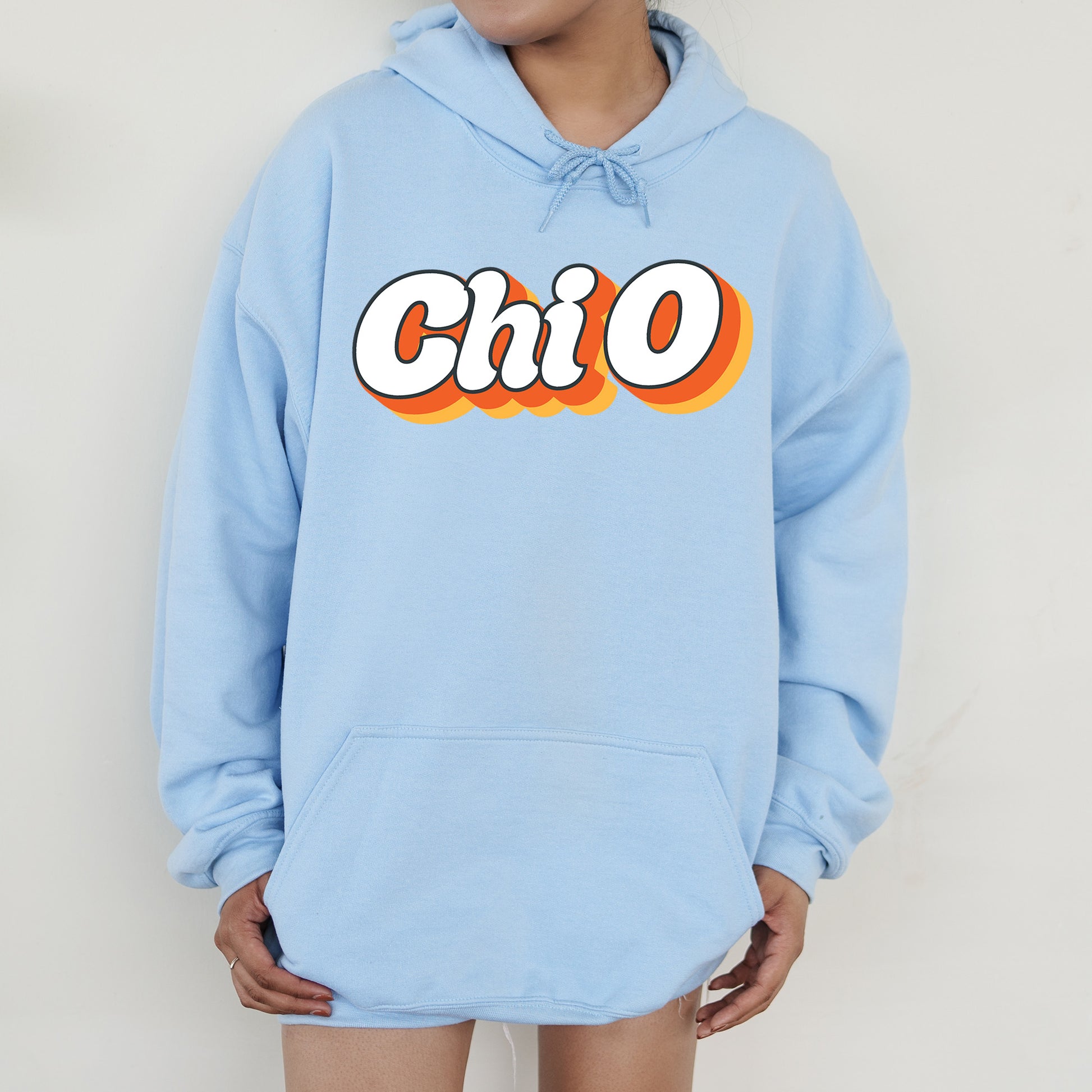 a person wearing a blue hoodie with the word chio on it