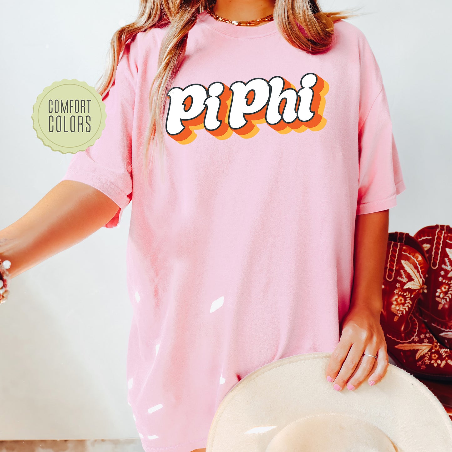 a woman wearing a pink shirt with the word pippi on it