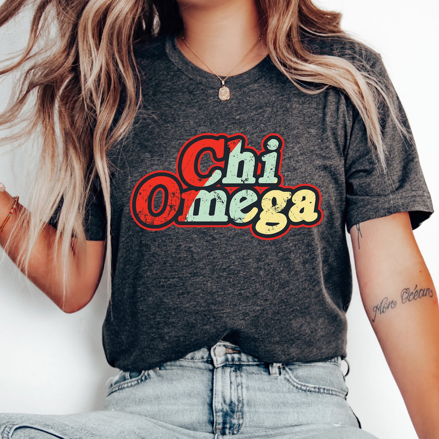a woman wearing a shirt that says chi omega