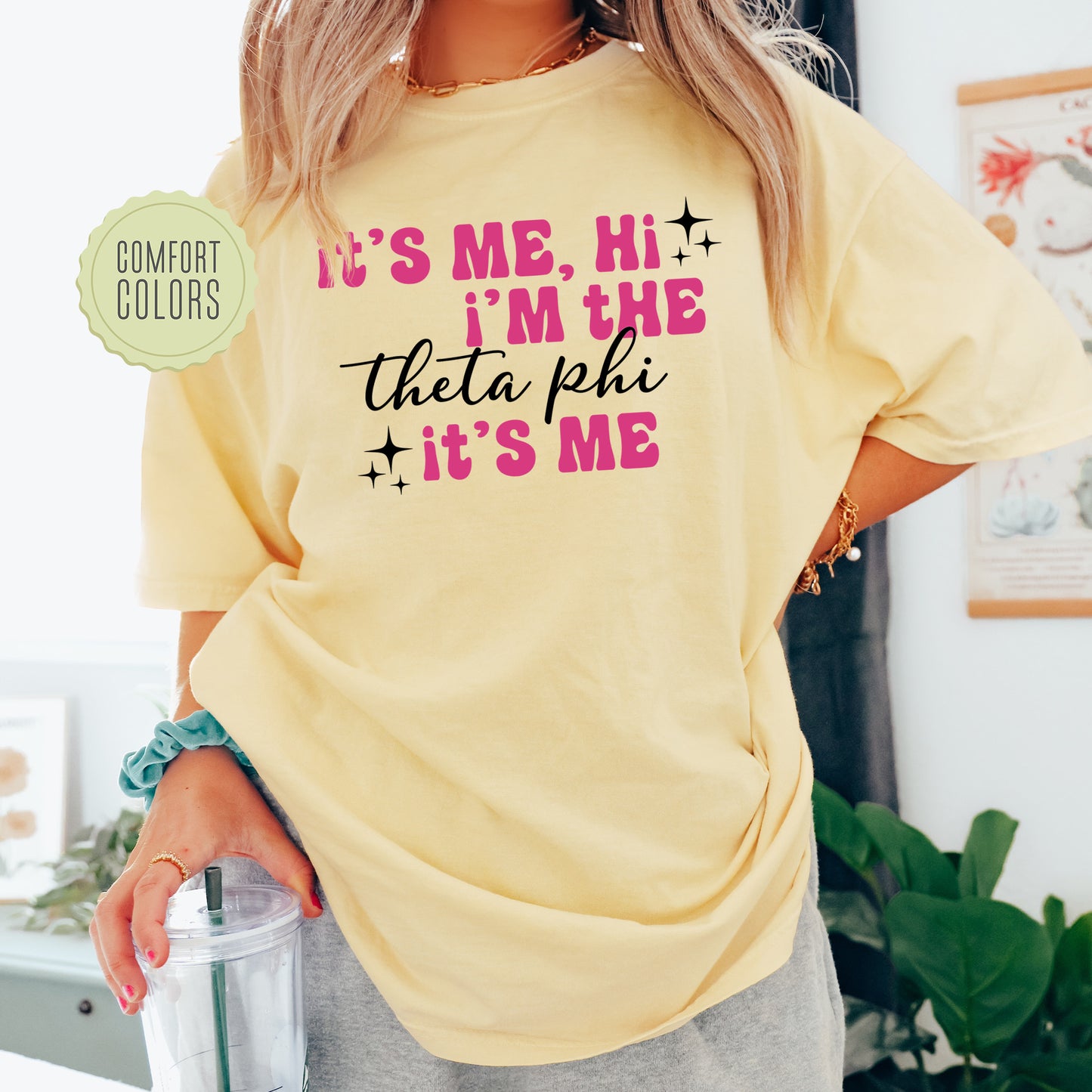 a woman wearing a yellow tshirt that says it's me, i