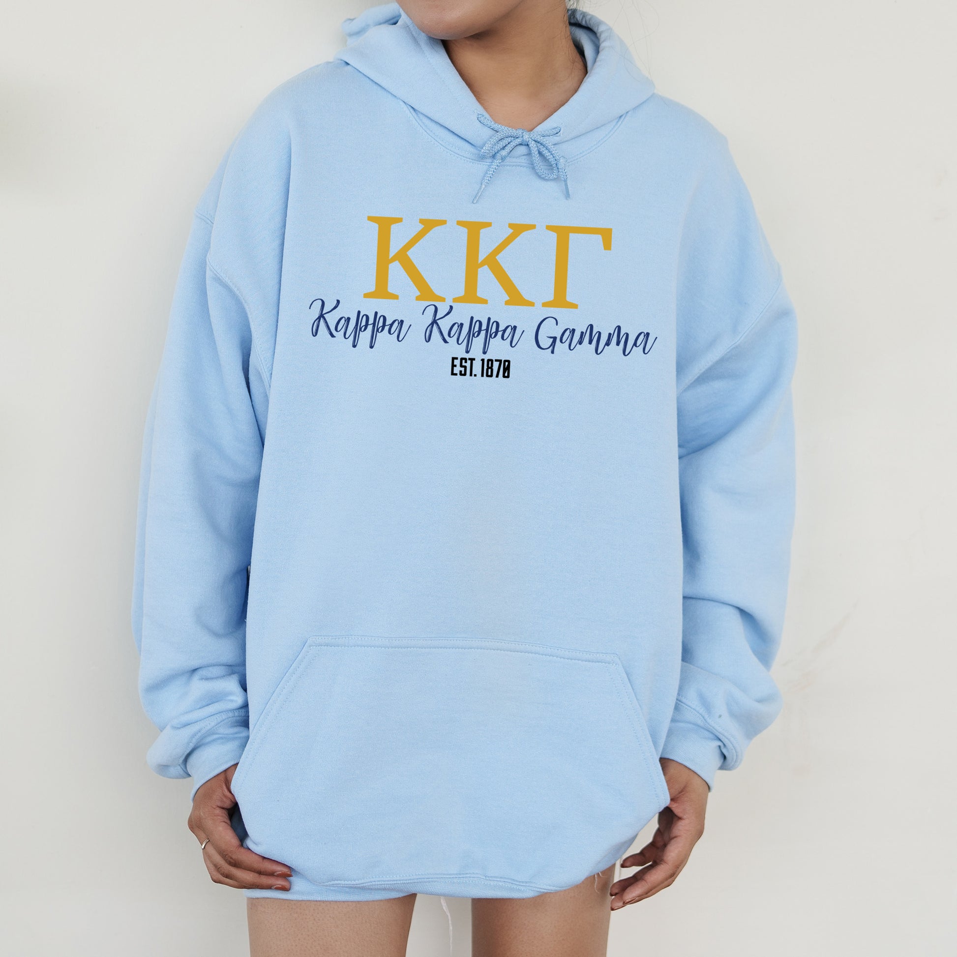 a person wearing a blue hoodie that says kit happy happy grandma