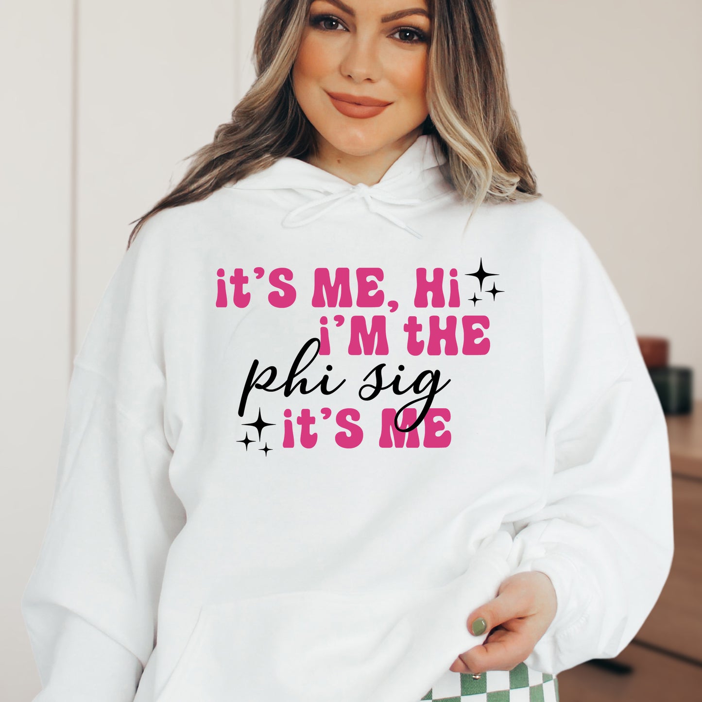 a woman wearing a white hoodie that says it's me, i '