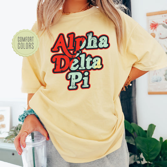 a woman wearing a yellow shirt with the words aloh delta pi on it