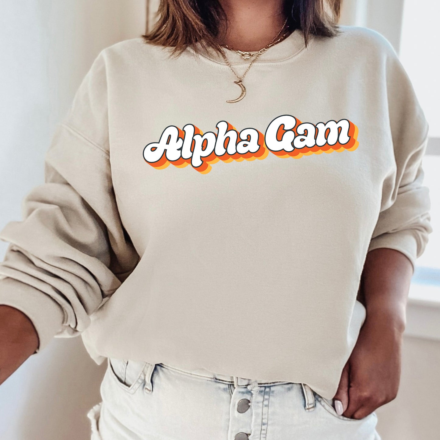 a woman wearing a sweatshirt with the word apha cam on it