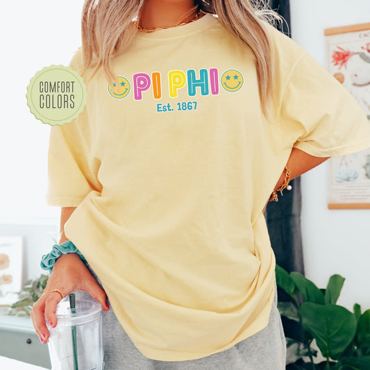 a woman in a yellow shirt holding a blender