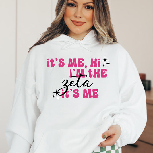 a woman wearing a white hoodie that says it's me, hit i