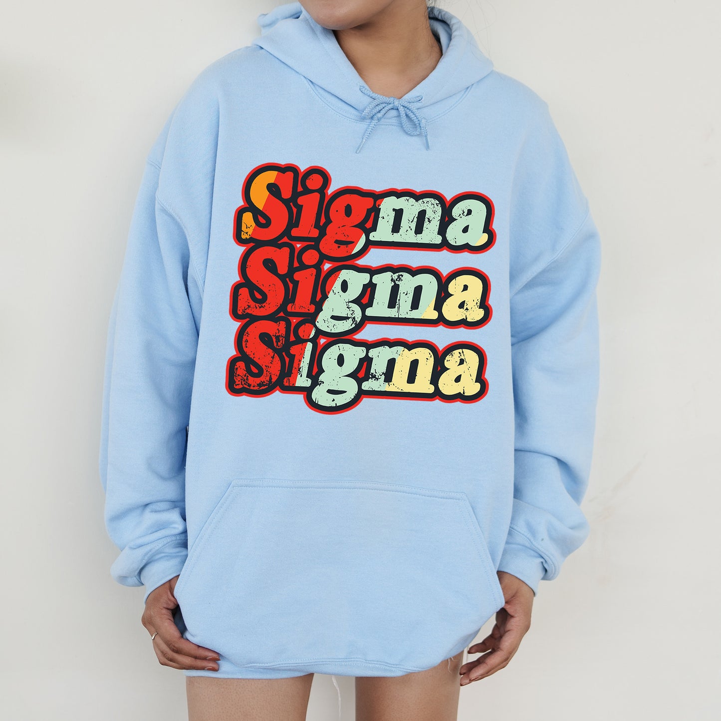 a person wearing a blue hoodie with the words stigma stigma stigma on it