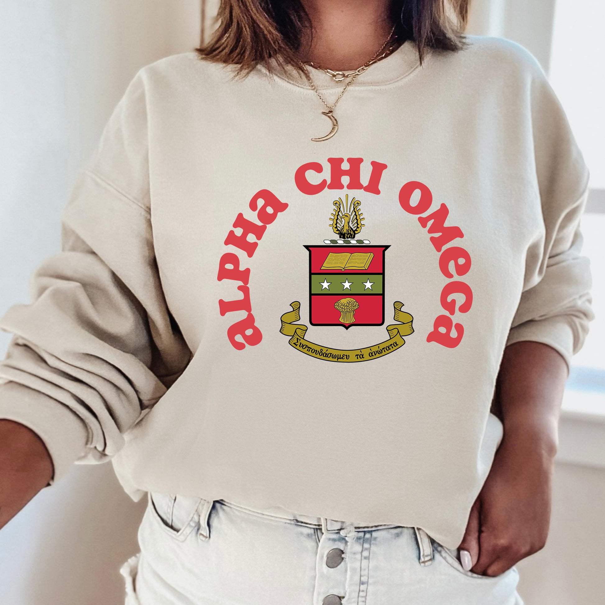 a woman wearing a sweatshirt with a crest on it