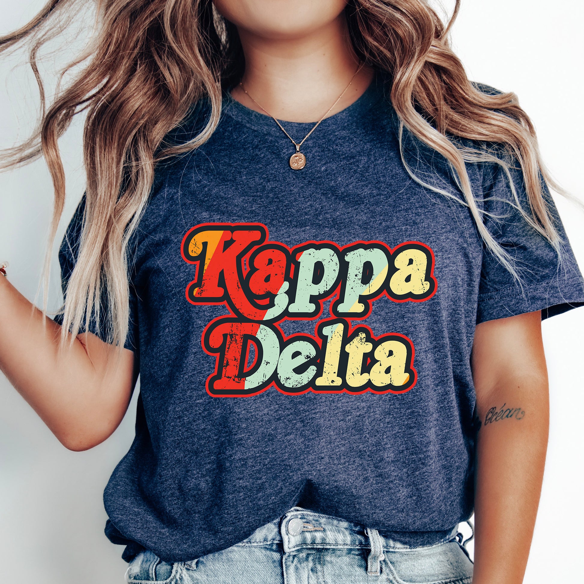 a woman wearing a t - shirt that says kapa delta