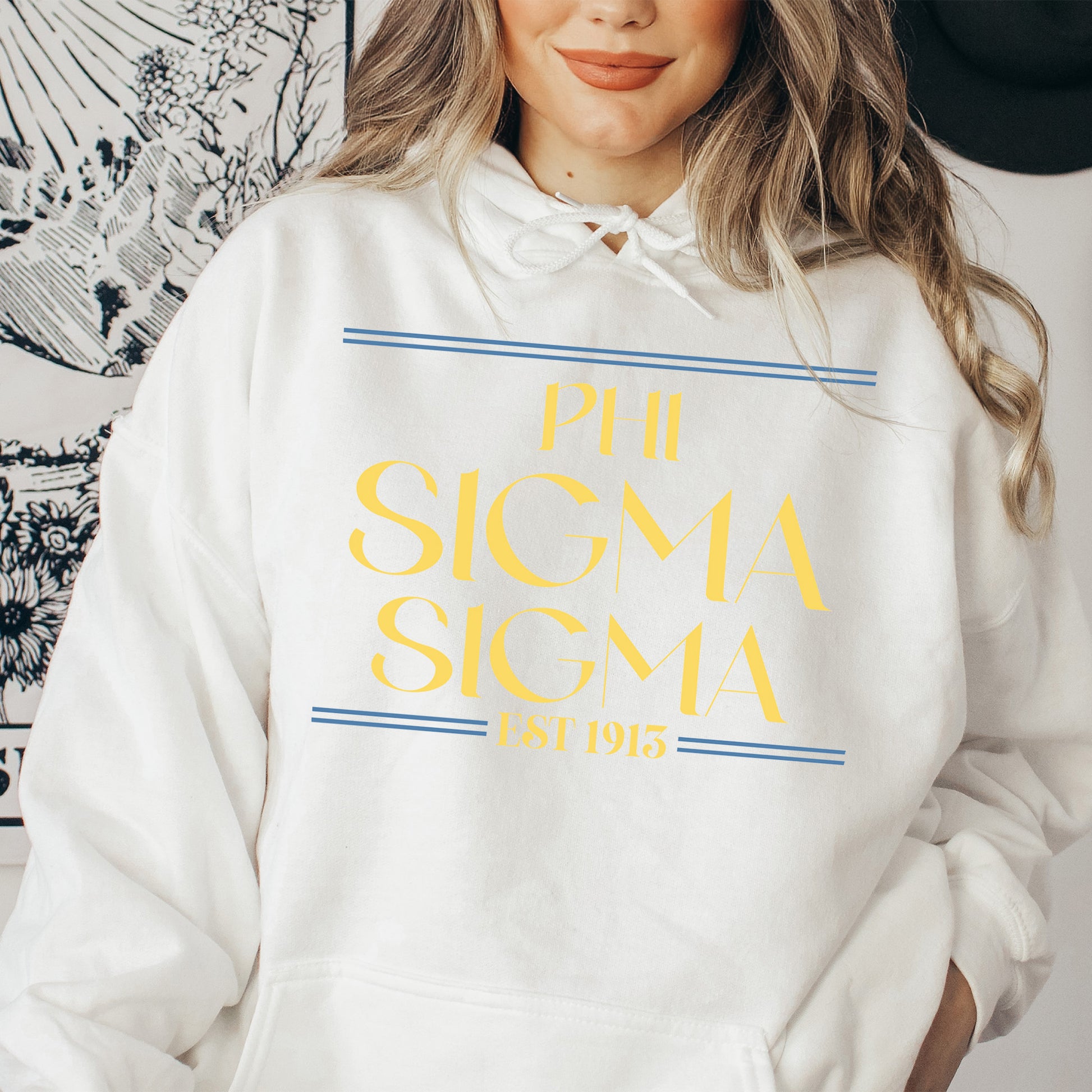 a woman wearing a white sweatshirt and a hat