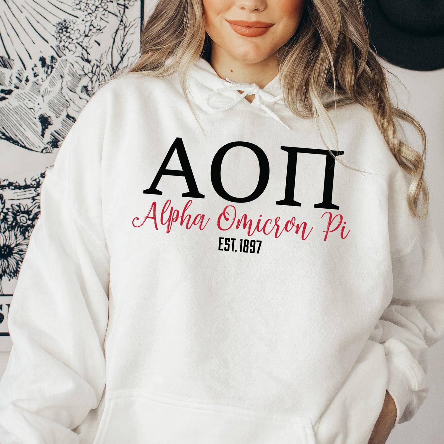 a woman wearing a white hoodie with the word aoi on it