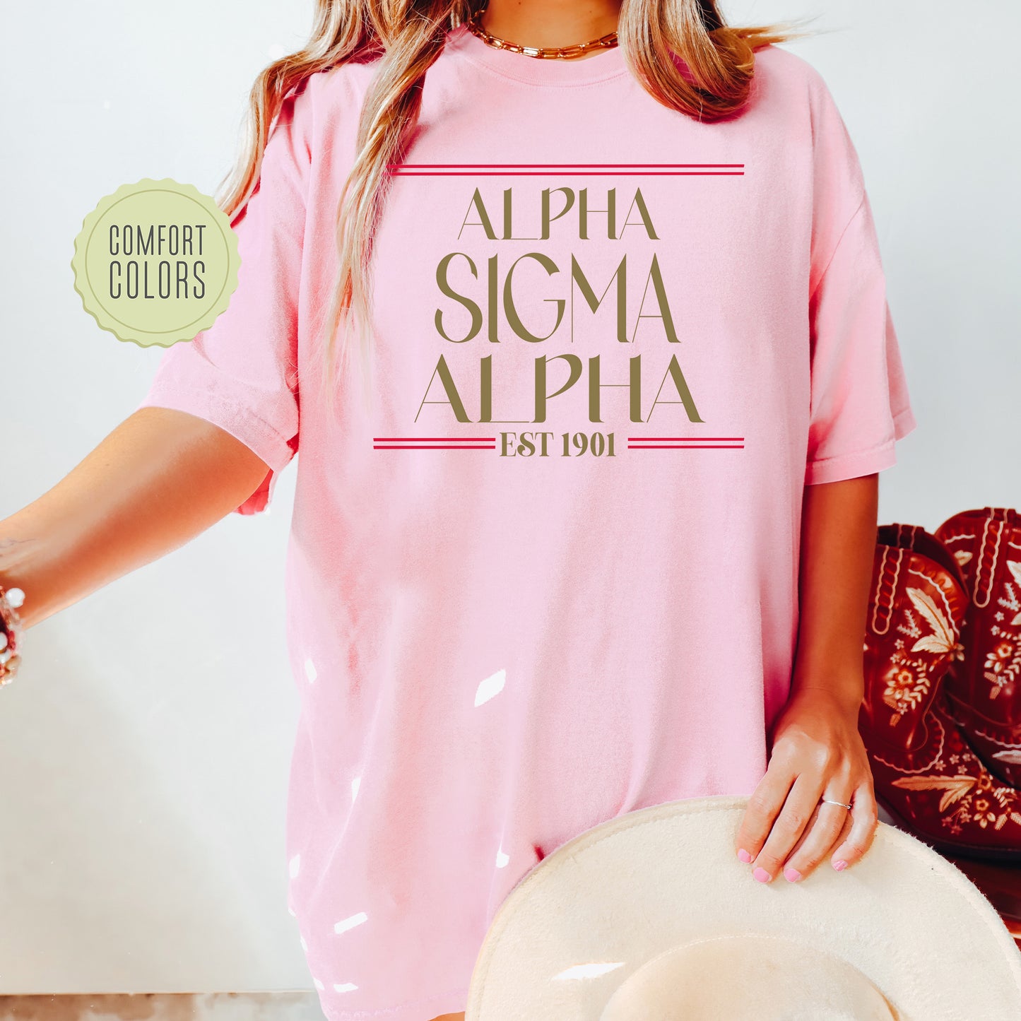 a woman wearing a pink shirt and hat