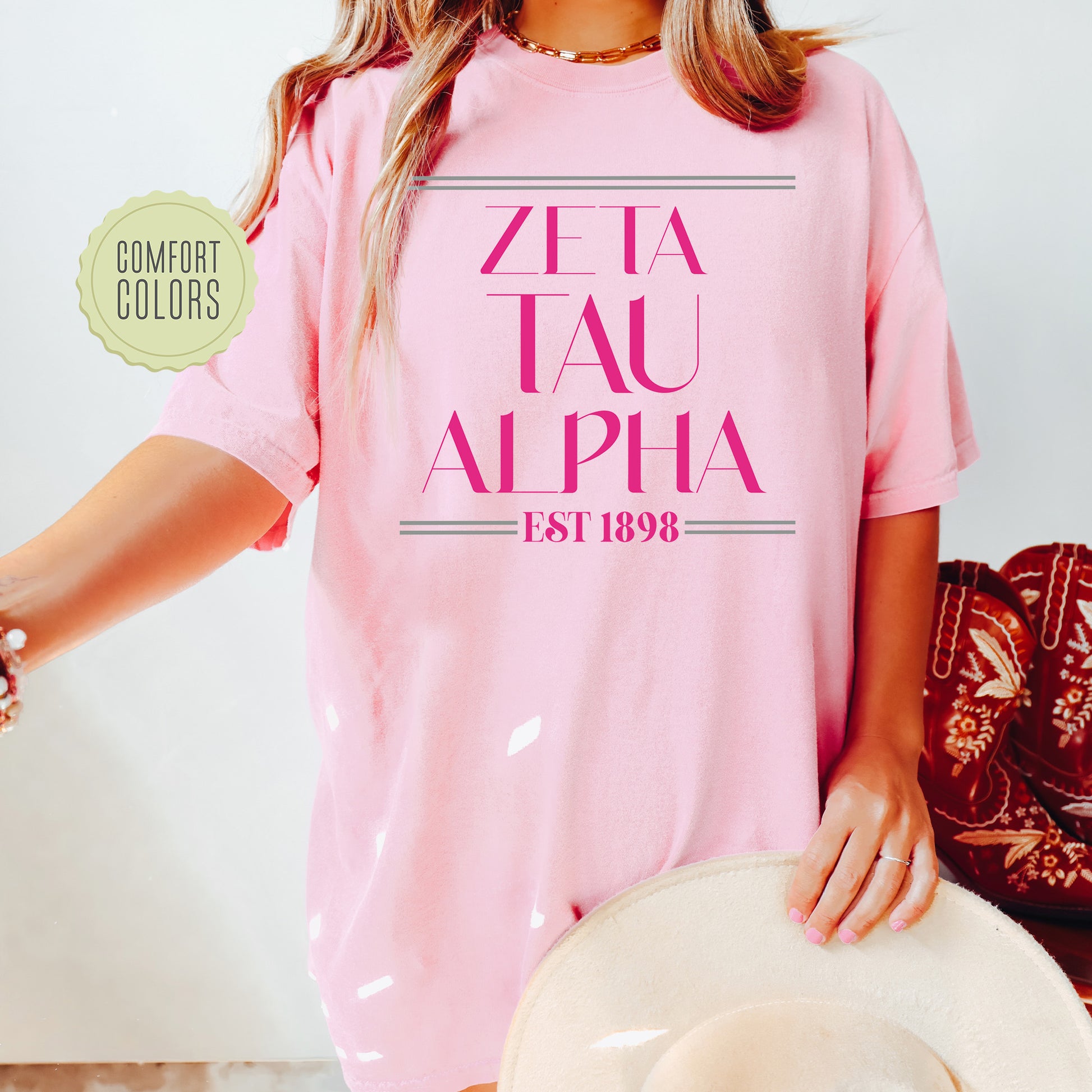 a woman wearing a pink shirt and hat