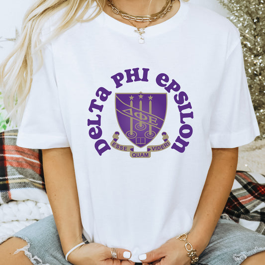 a woman wearing a white shirt that says delta phi estron
