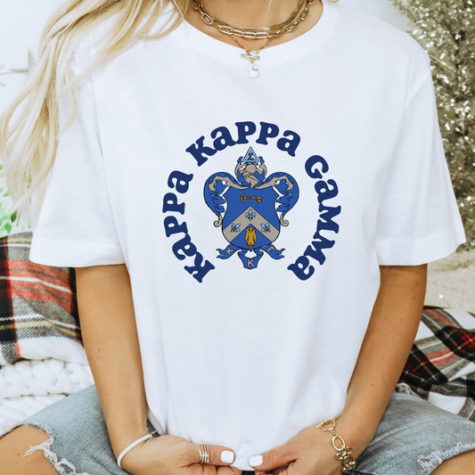 a woman wearing a white shirt with a blue heart on it