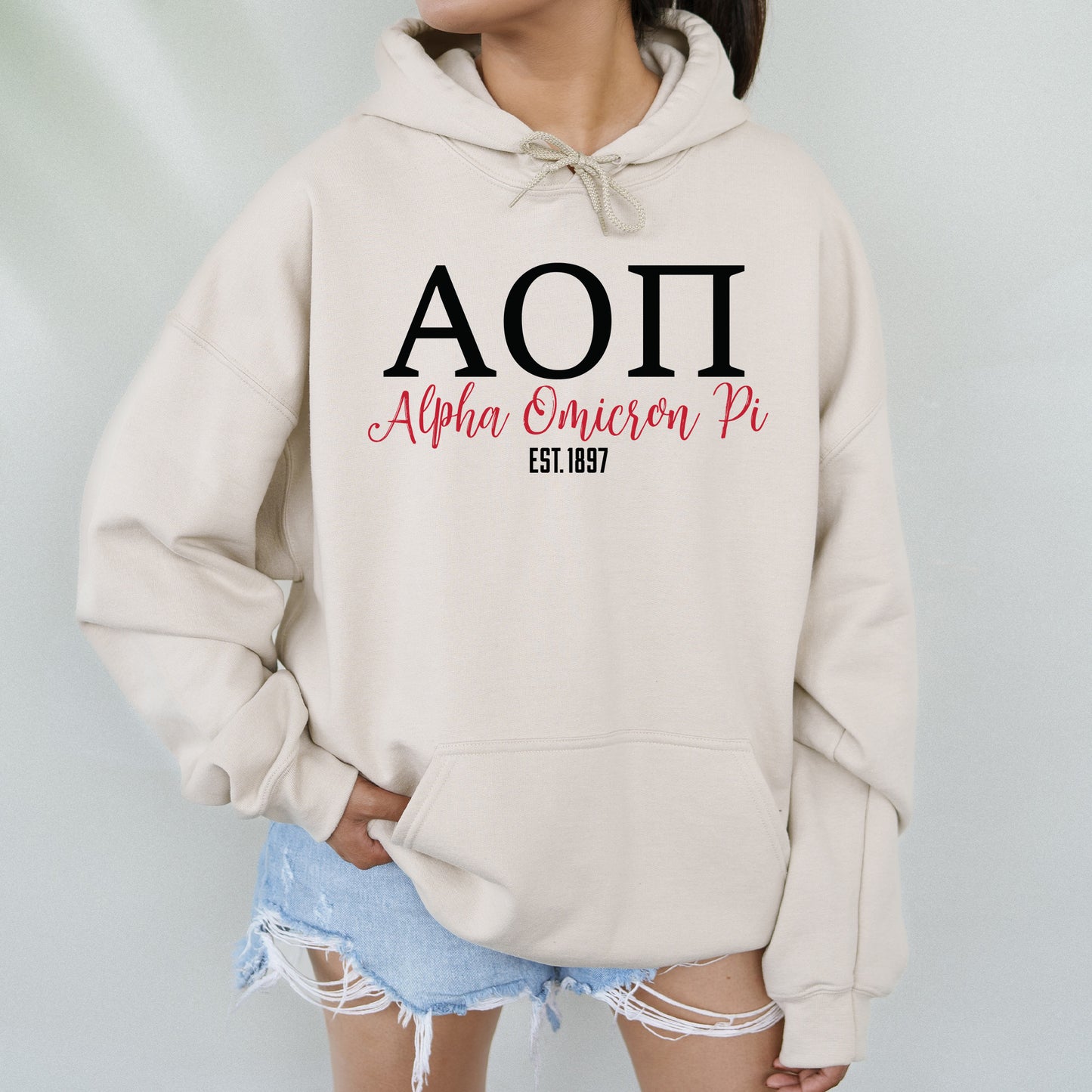 a woman wearing a sweatshirt with the word aoi on it