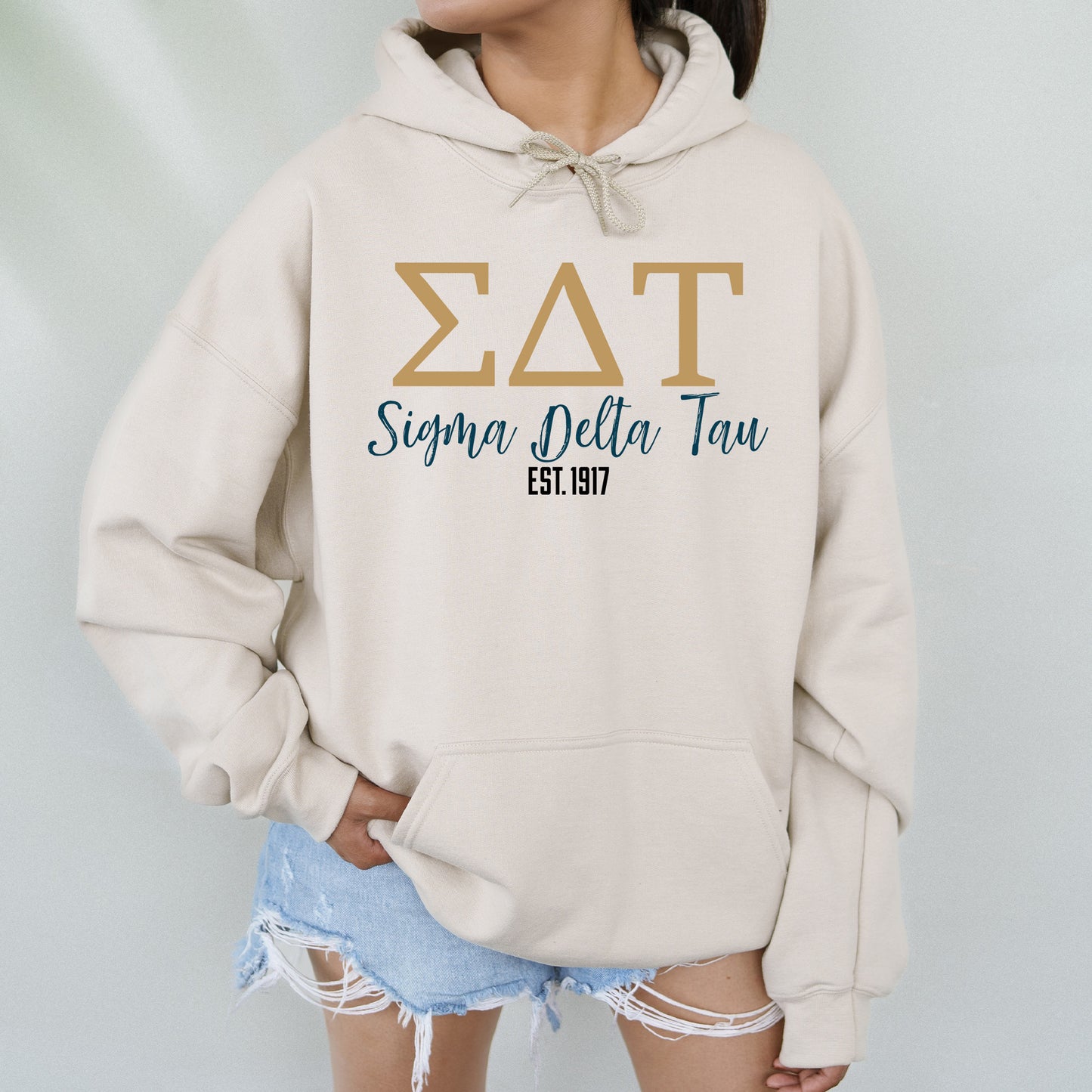 a woman wearing a sweatshirt with the word zat on it