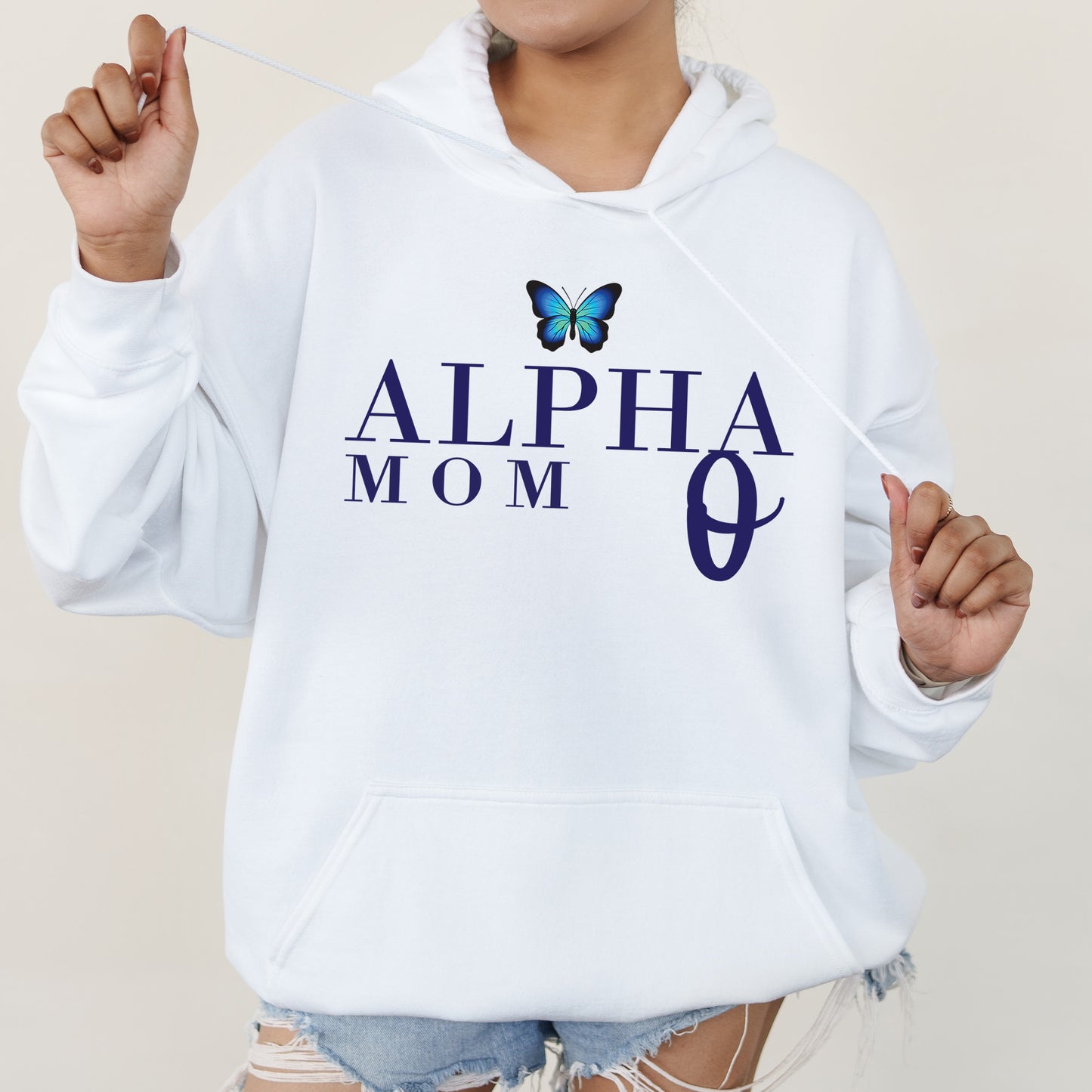 a woman in a white hoodie with a butterfly on it