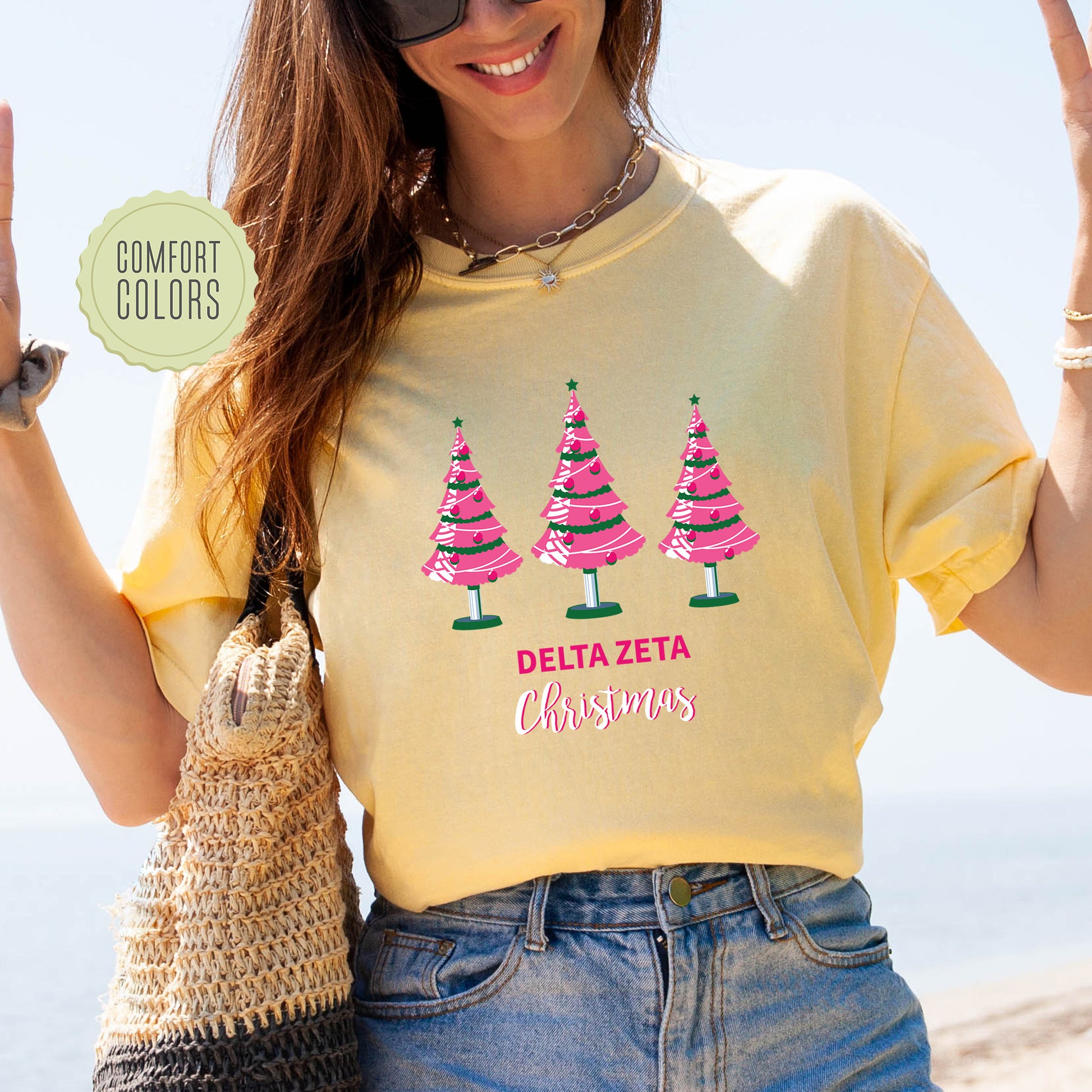a woman wearing a t - shirt with trees on it