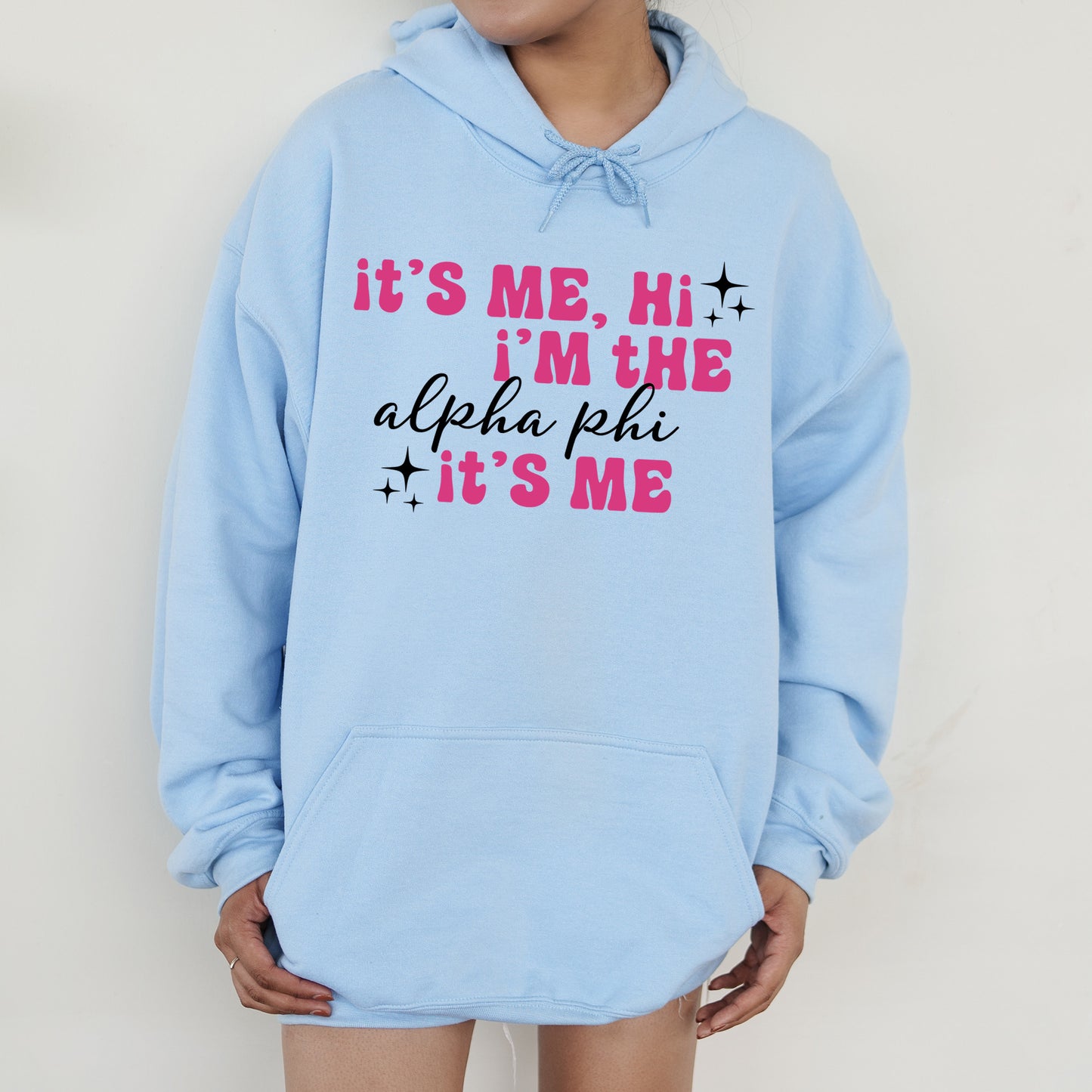 a person wearing a blue hoodie that says it's me, i '