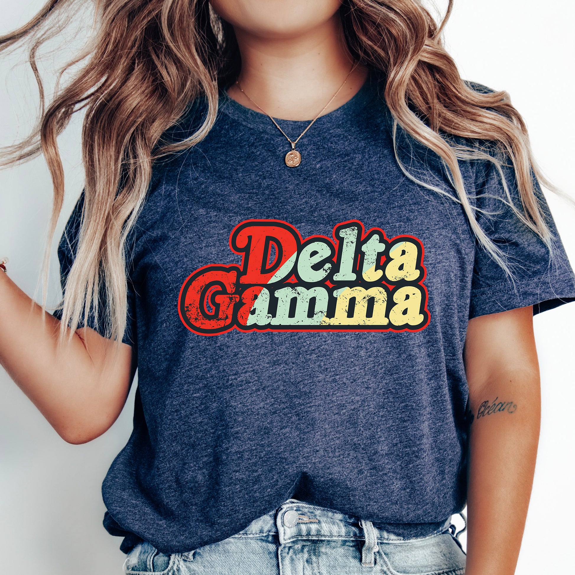 a woman with long hair wearing a delta gumma t - shirt