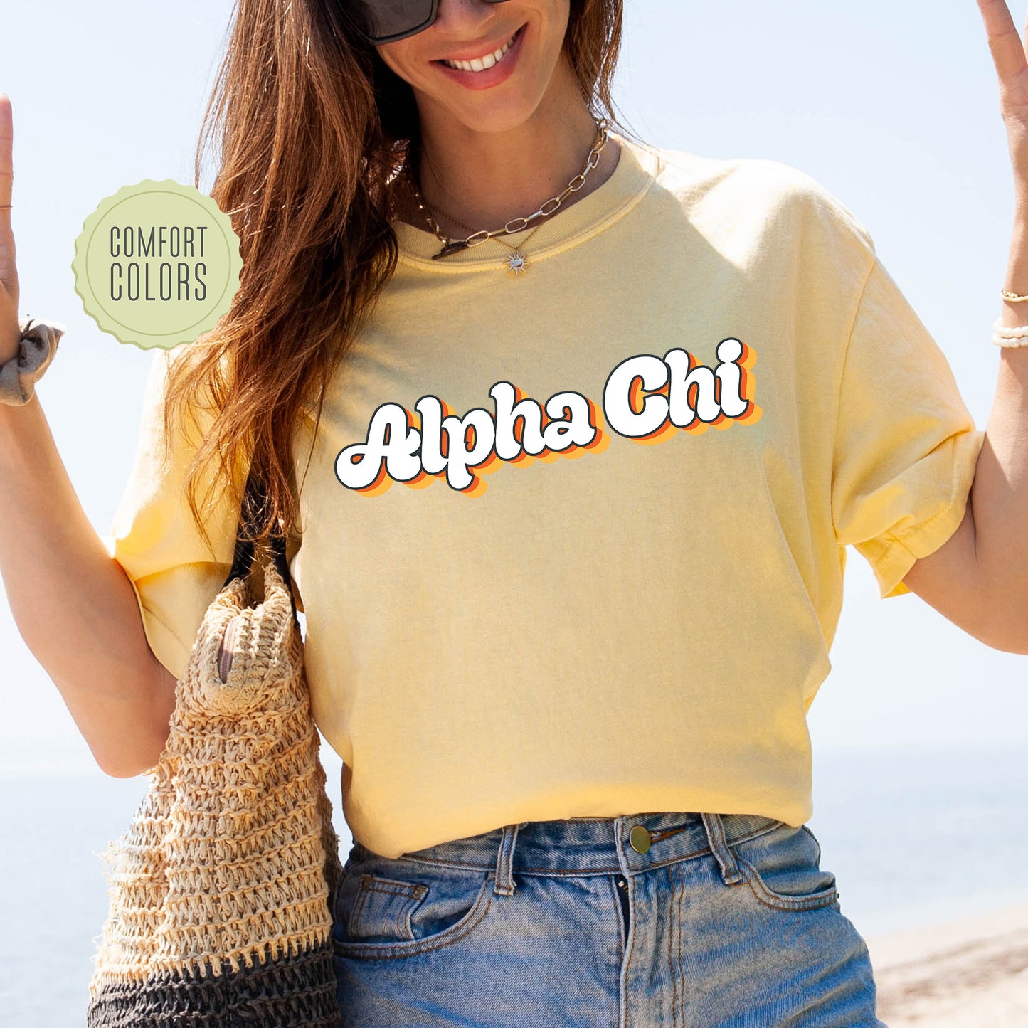 a woman in a yellow shirt holding up a peace sign