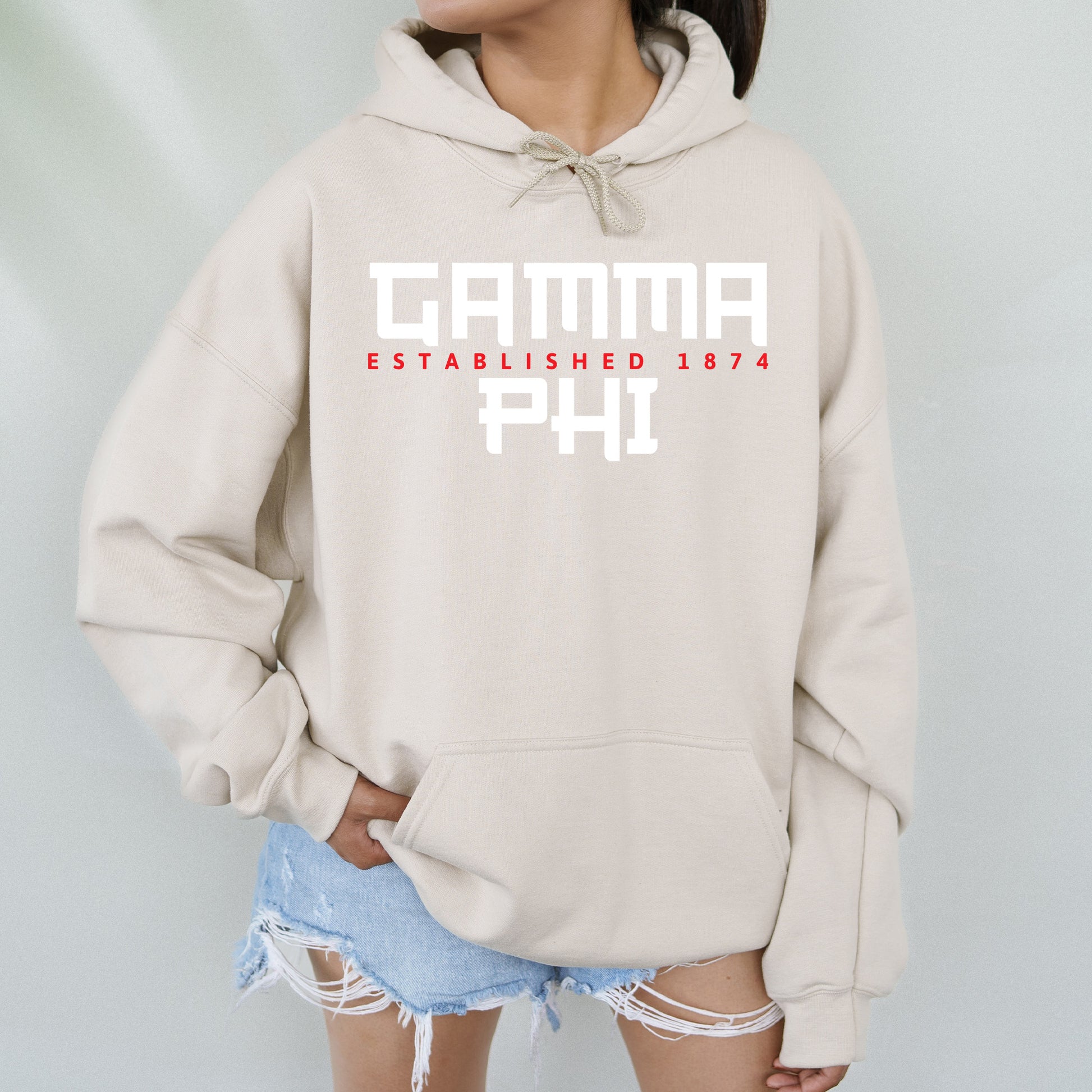 a woman wearing a hoodie that says camma established 1971