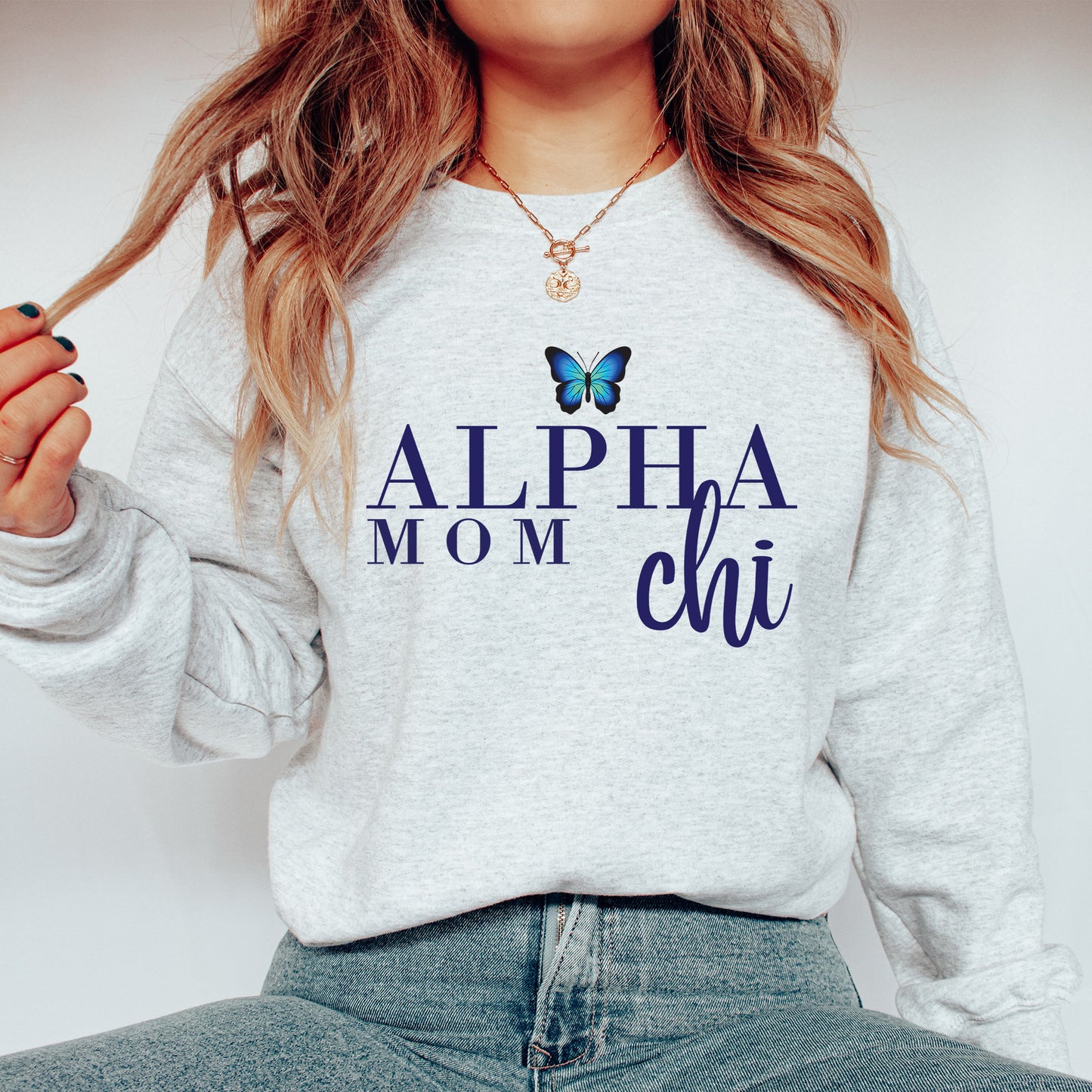 a woman wearing a sweatshirt with a butterfly on it