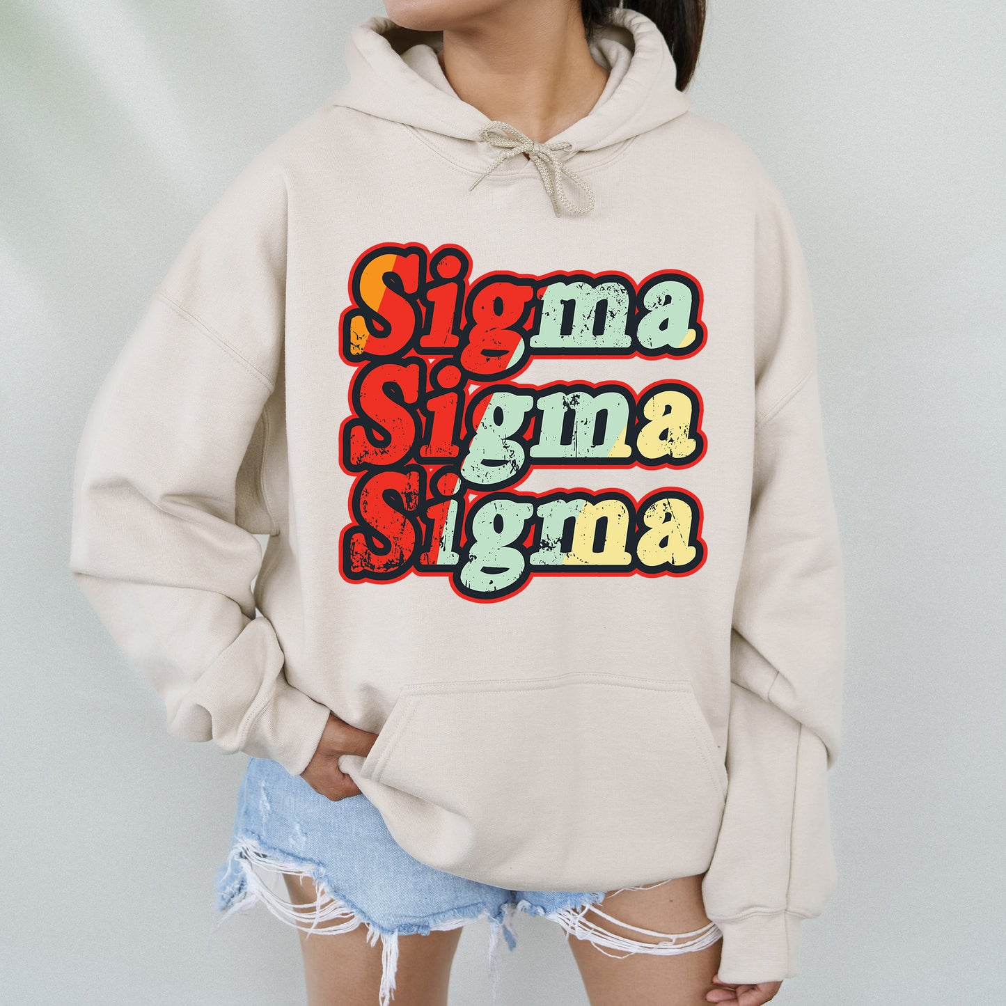 a woman wearing a sweatshirt with the words stigma stigma stigma on it