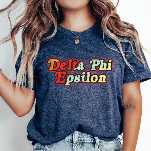 a woman with long hair wearing a delta phi shirt