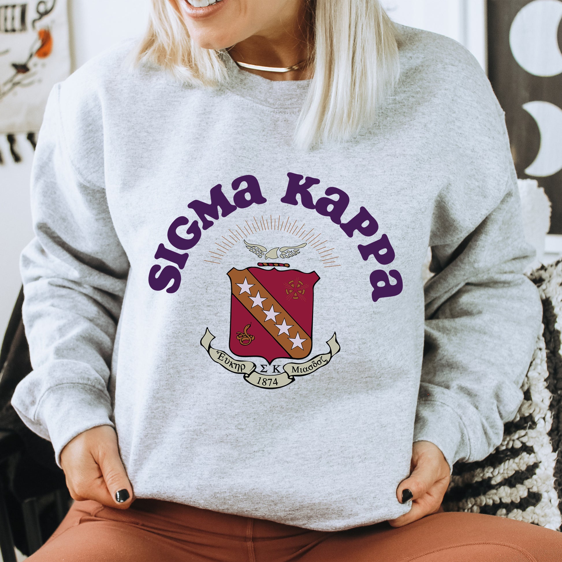 a woman sitting on a chair wearing a sweater