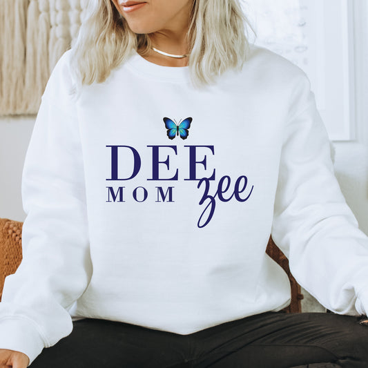 a woman wearing a sweatshirt that says deee mom gee