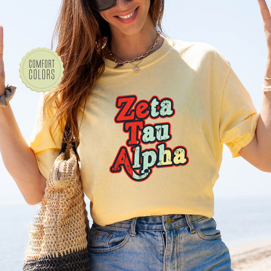 a woman in a yellow shirt is holding up a peace sign