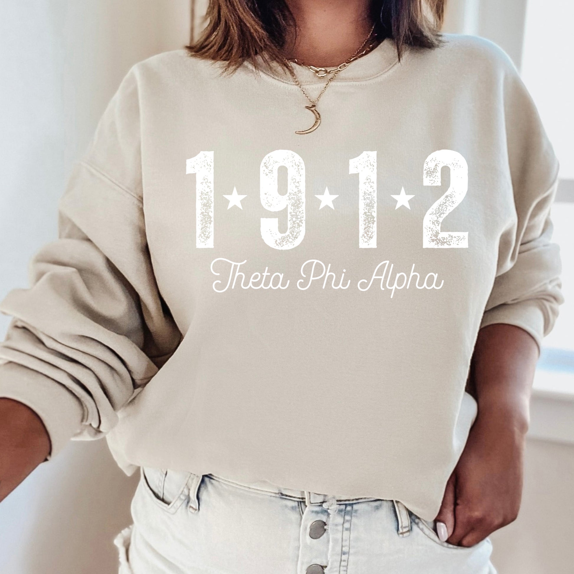 a woman wearing a sweatshirt with the year 1911 printed on it