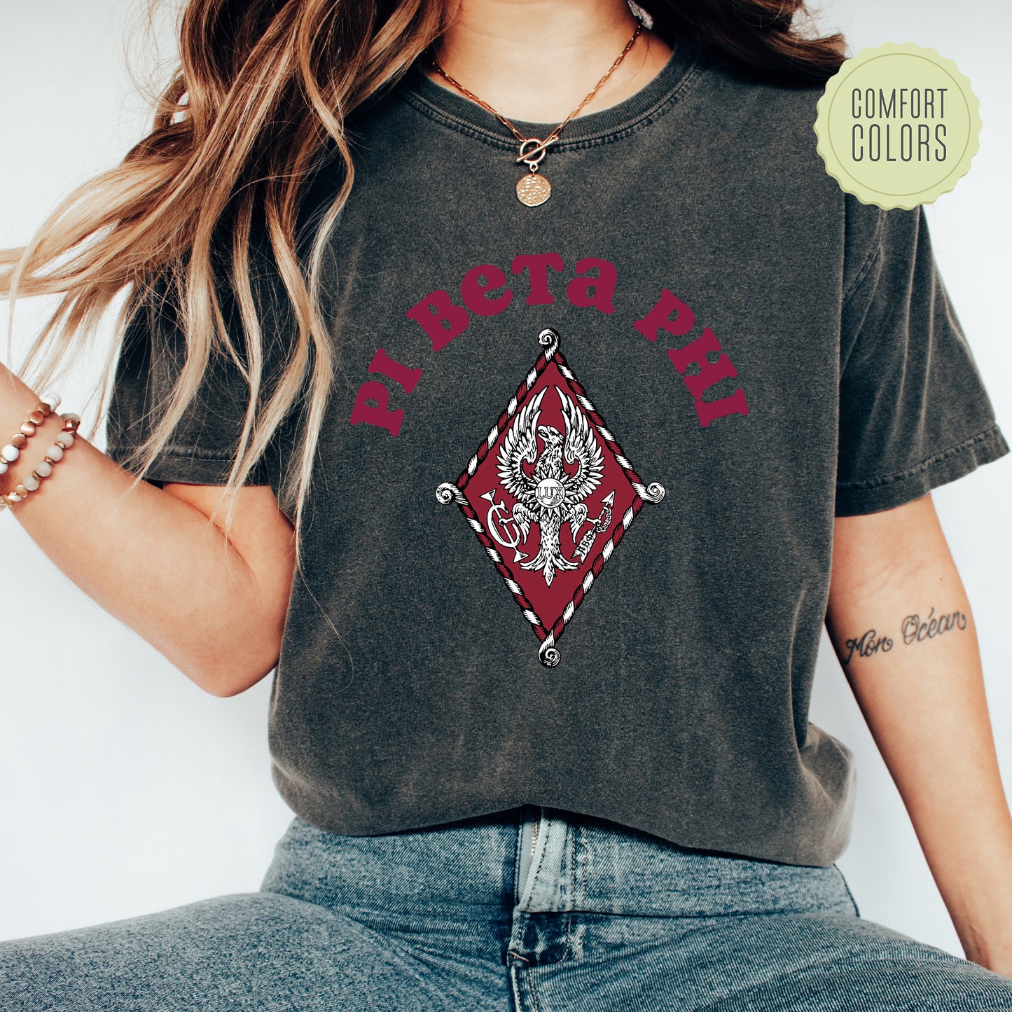 a woman wearing a shirt with a dragon on it