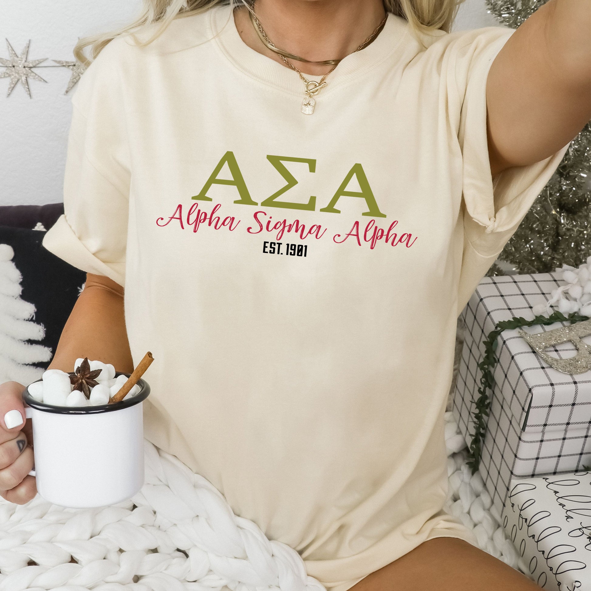a woman sitting on a bed holding a cup of coffee