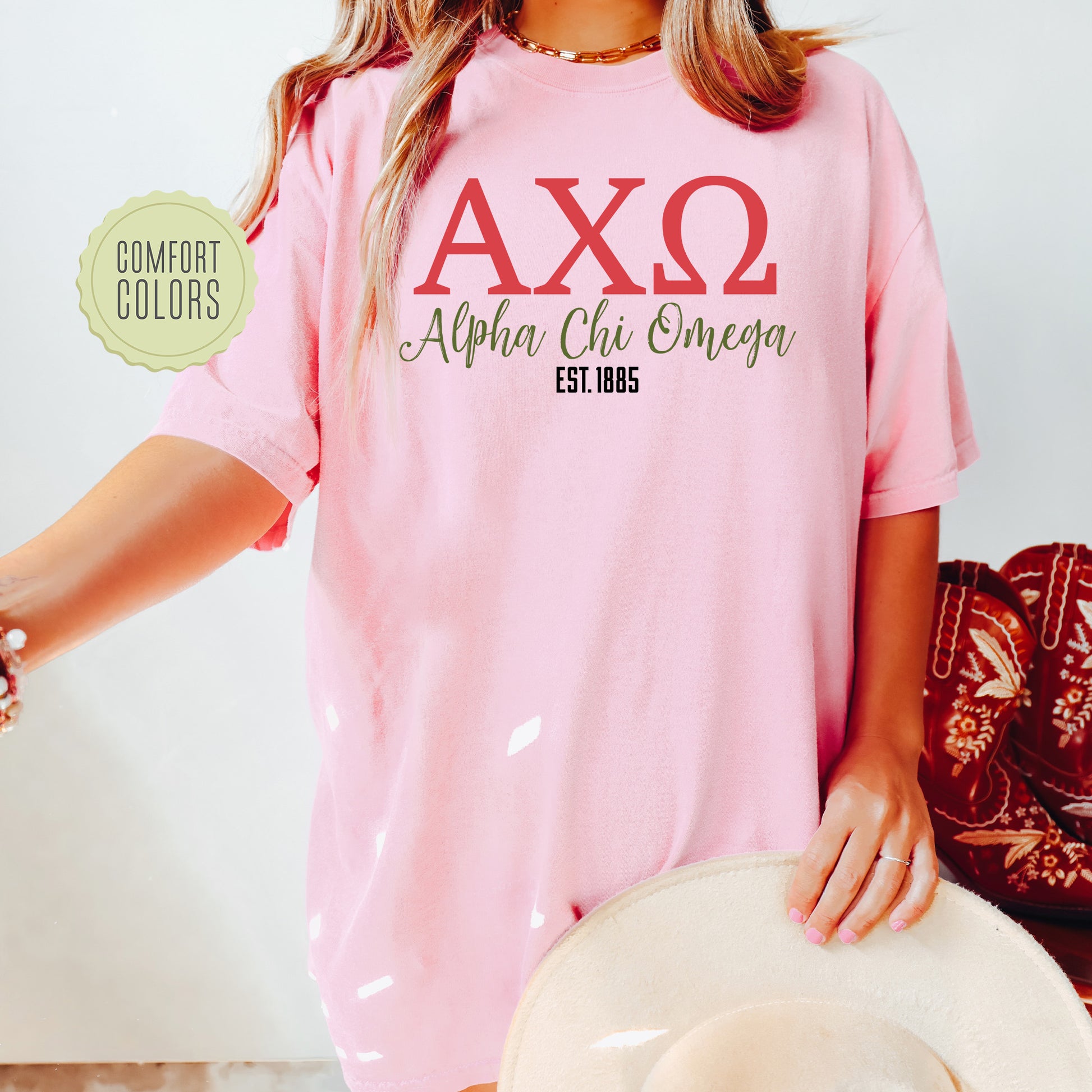a woman wearing a pink shirt and hat