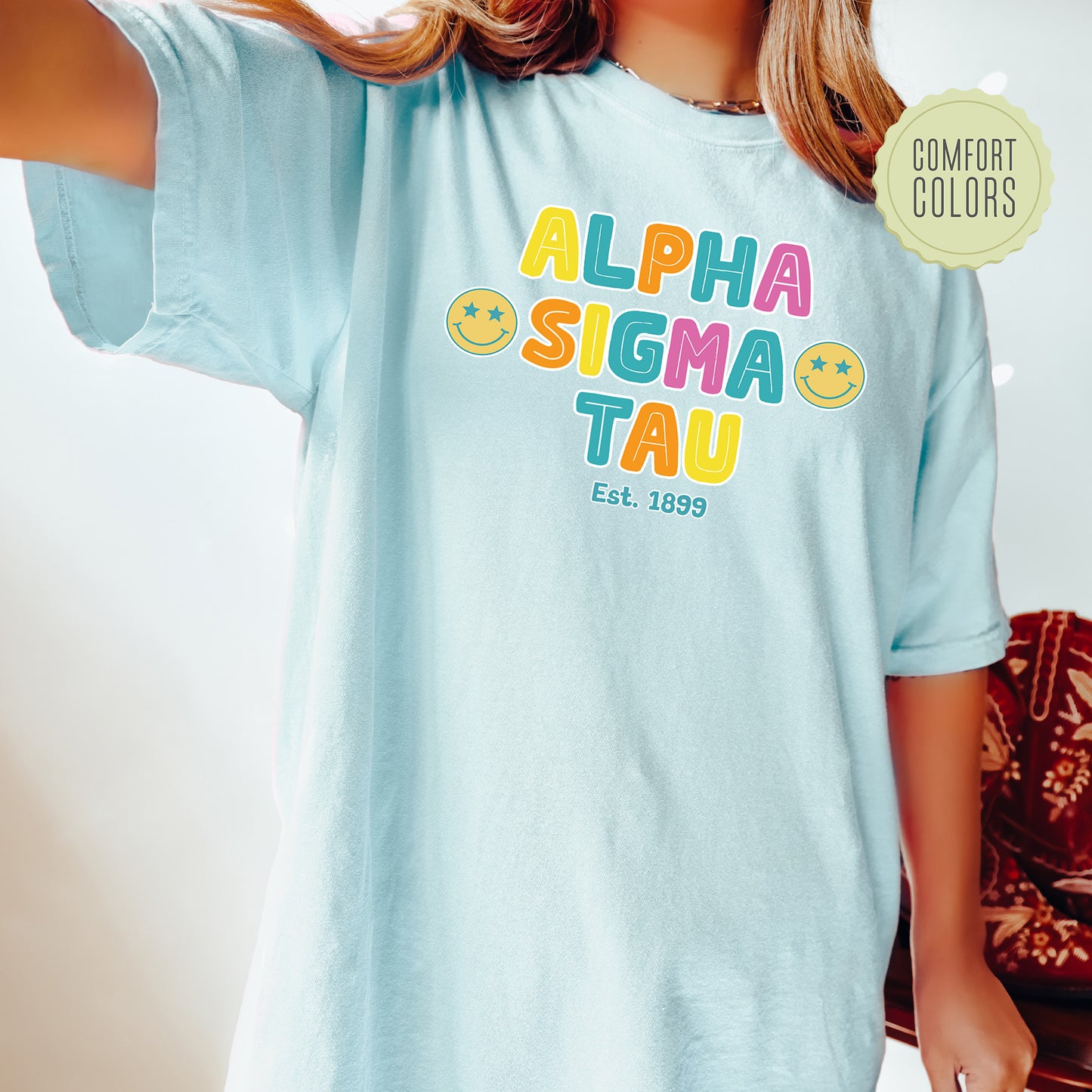 a woman wearing a blue shirt with the words aloha sema tau on
