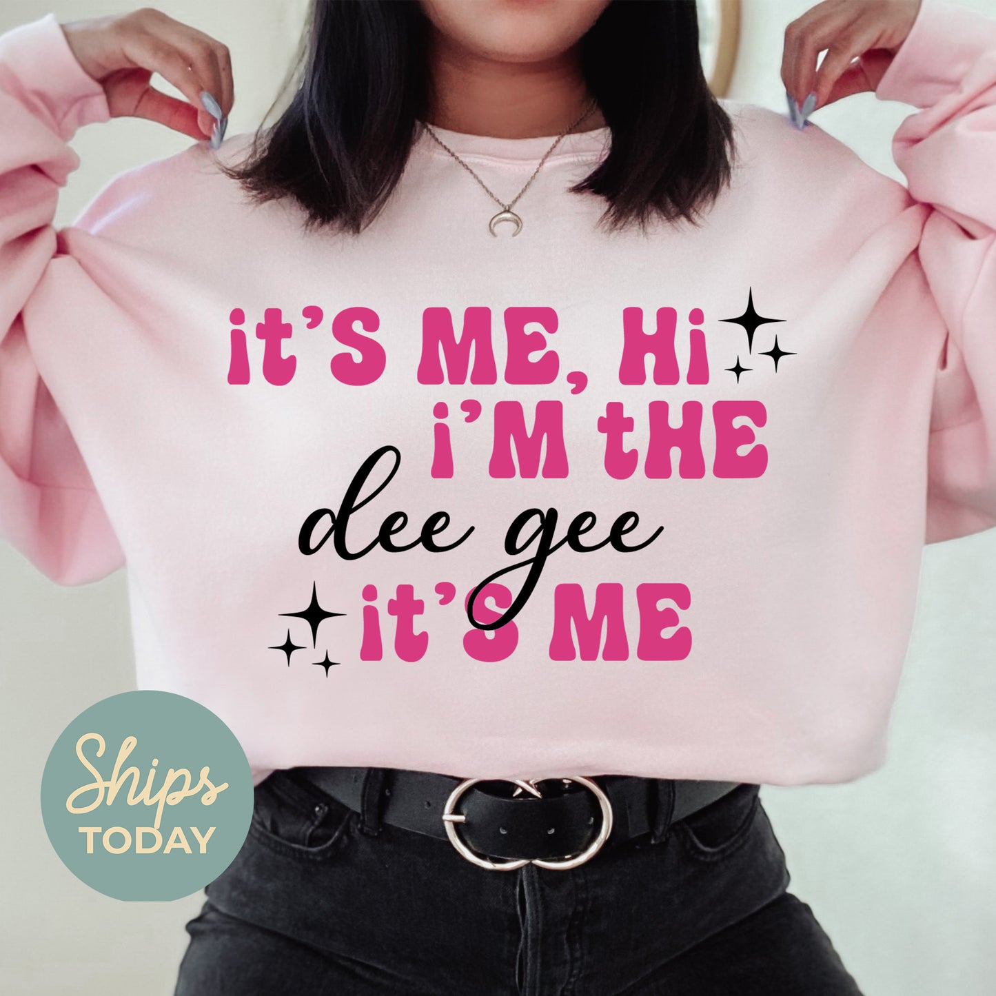 a woman wearing a pink sweatshirt that says it's me, i'm