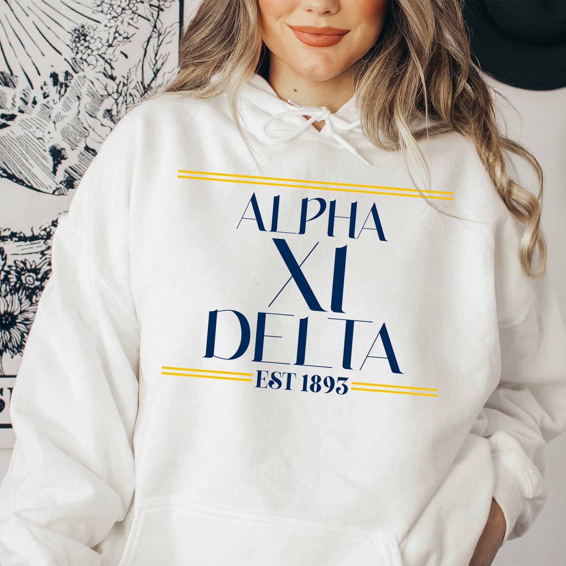 a woman wearing a white hoodie and a hat