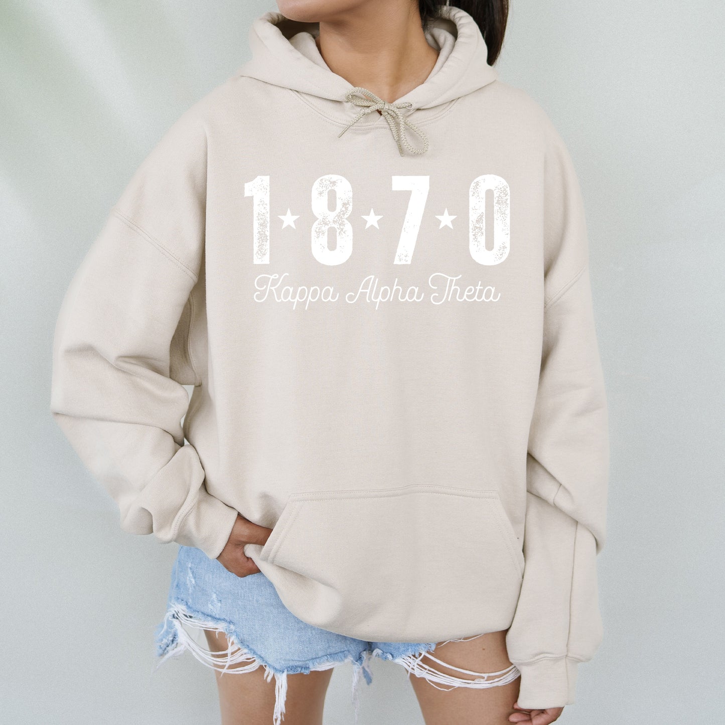 a woman wearing a sweatshirt with the number seventy on it