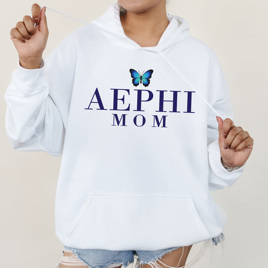 a woman wearing a white hoodie with a butterfly on it