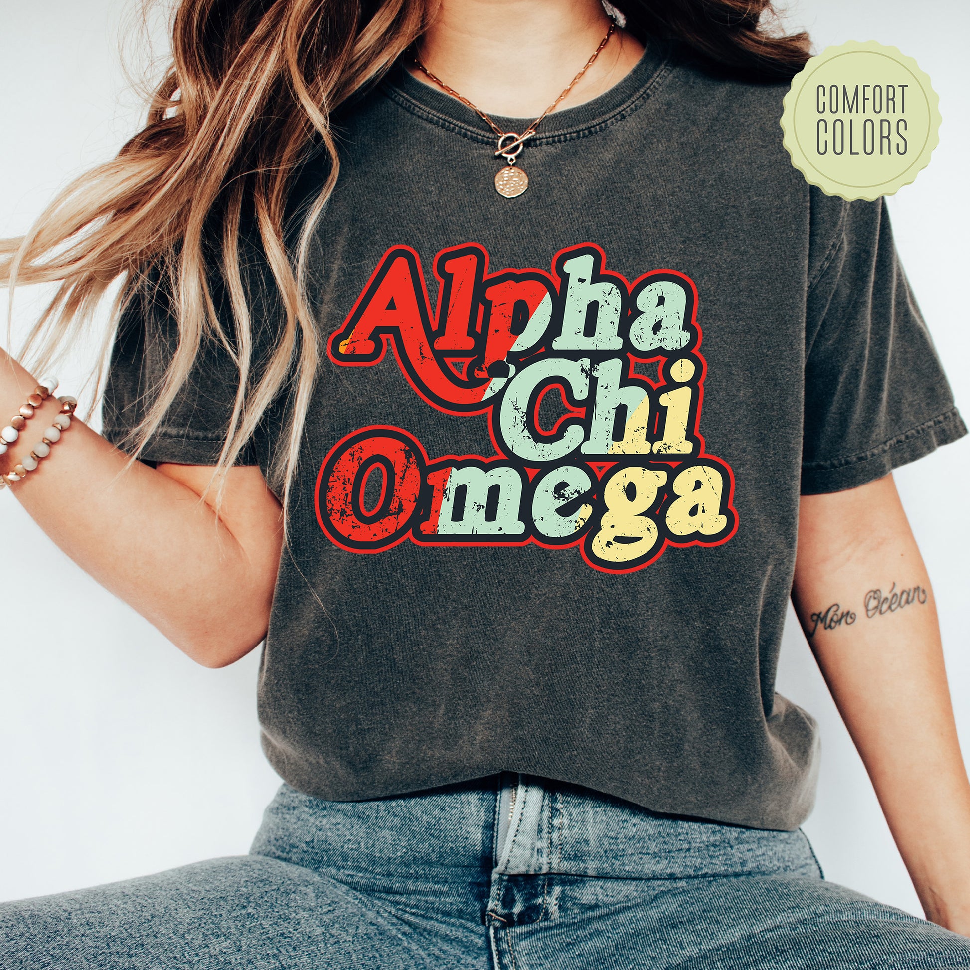 a woman wearing a black shirt with the words aloha chii omeg