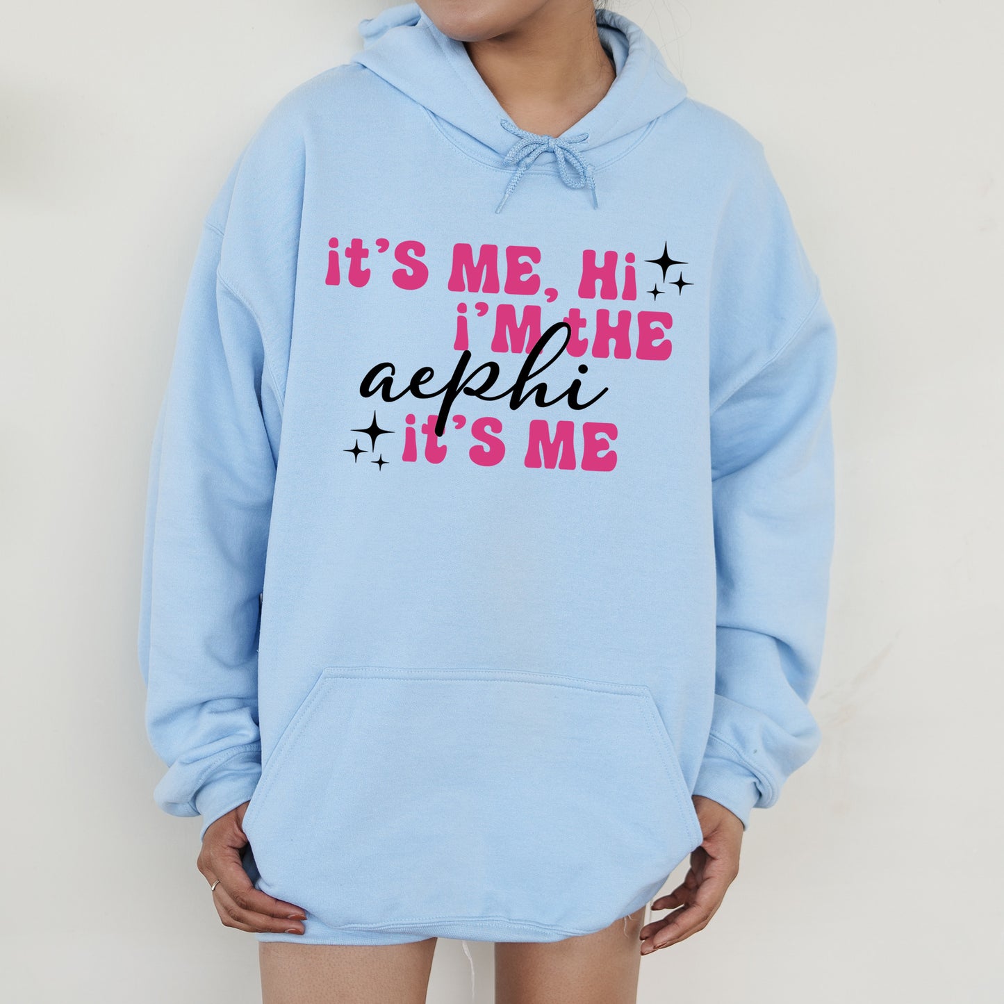 a person wearing a blue hoodie that says it's me, i '