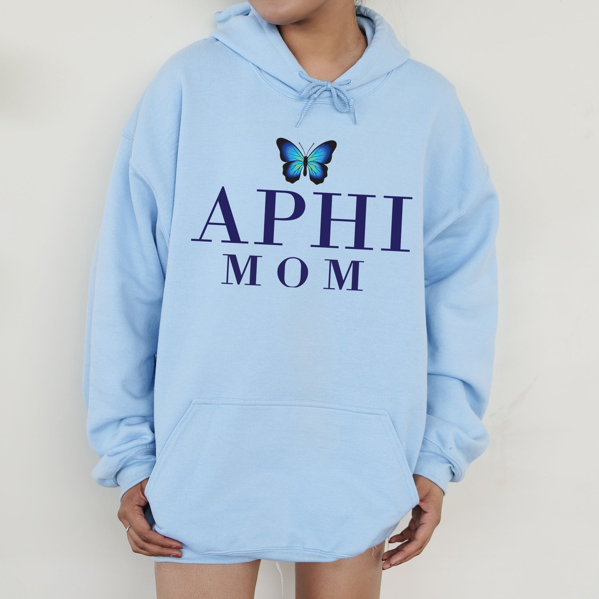 a woman wearing a blue hoodie with a butterfly on it